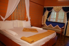 Close-up of luxurious bed linens and comfortable pillows in a Nest Inn Resort bedroom.