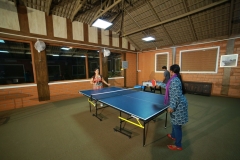 Families bonding over board games in the well-appointed indoor games area